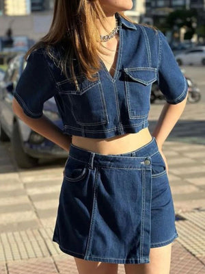 Dark blue denim cropped utility shirt and asymmetric skort set with white stitching.