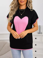 Black acrylic knit top with pink heart graphic, crew neck, short sleeves, and ribbed accents.