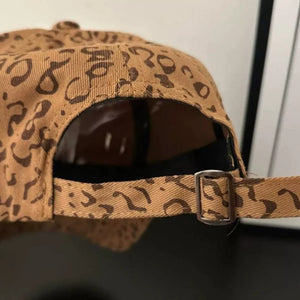 Tan baseball hat with brown leopard print and adjustable strap