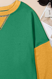 Green and yellow contrast crewneck sweatshirt with contrast stitching detail.