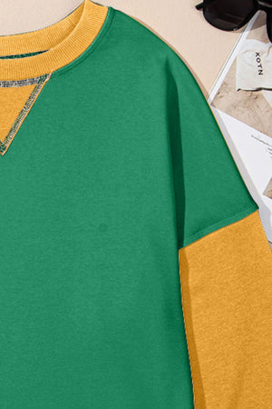 Green and yellow contrast crewneck sweatshirt with contrast stitching detail.