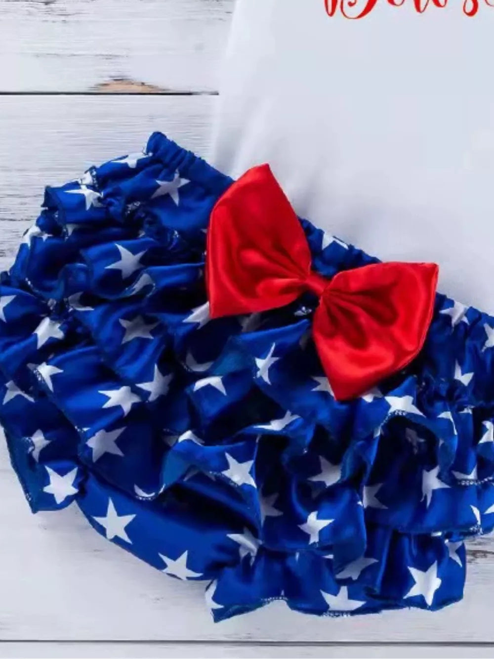 Baby bloomer set with blue star print and red bow detail.