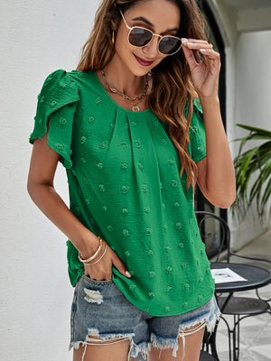 Green textured puff sleeve dot blouse with round neckline and short sleeves.