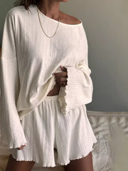 White ribbed knit lounge set with lettuce trim shorts and off-the-shoulder top.