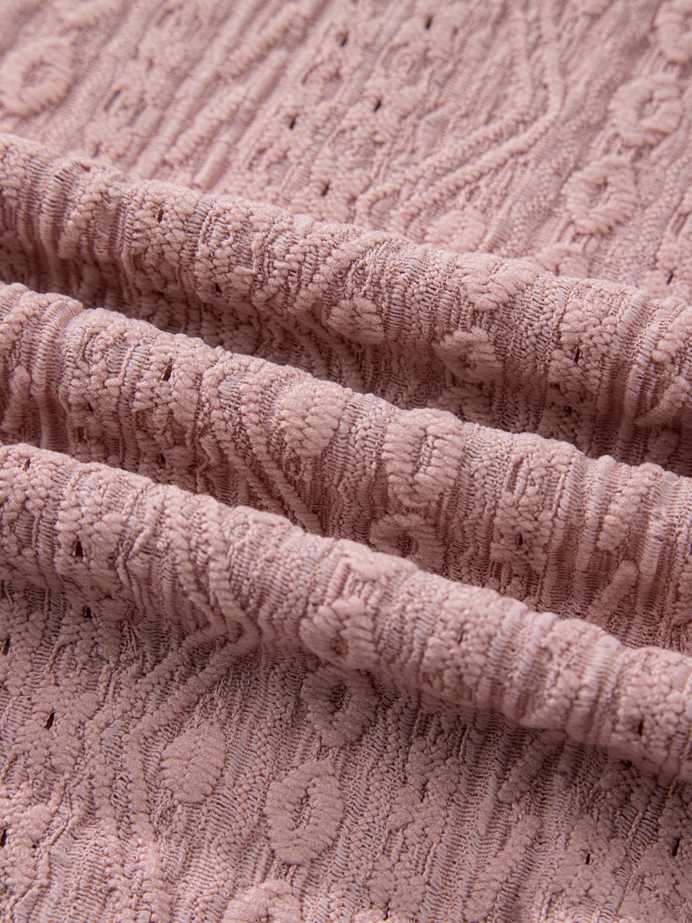 Pink eyelet embroidered blouse with textured fabric detail
