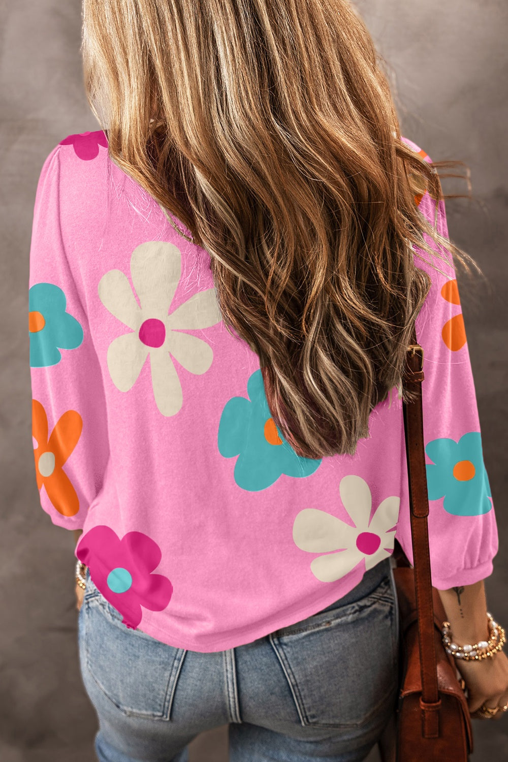 Pink t-shirt with a retro floral print and long sleeves.