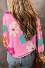 Pink t-shirt with a retro floral print and long sleeves.