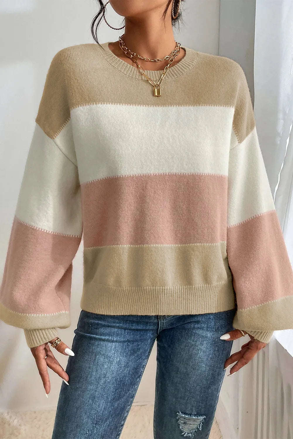 Chic contrast stripe sweater with lantern sleeves in acrylic, featuring tan, cream, and pink color blocking.