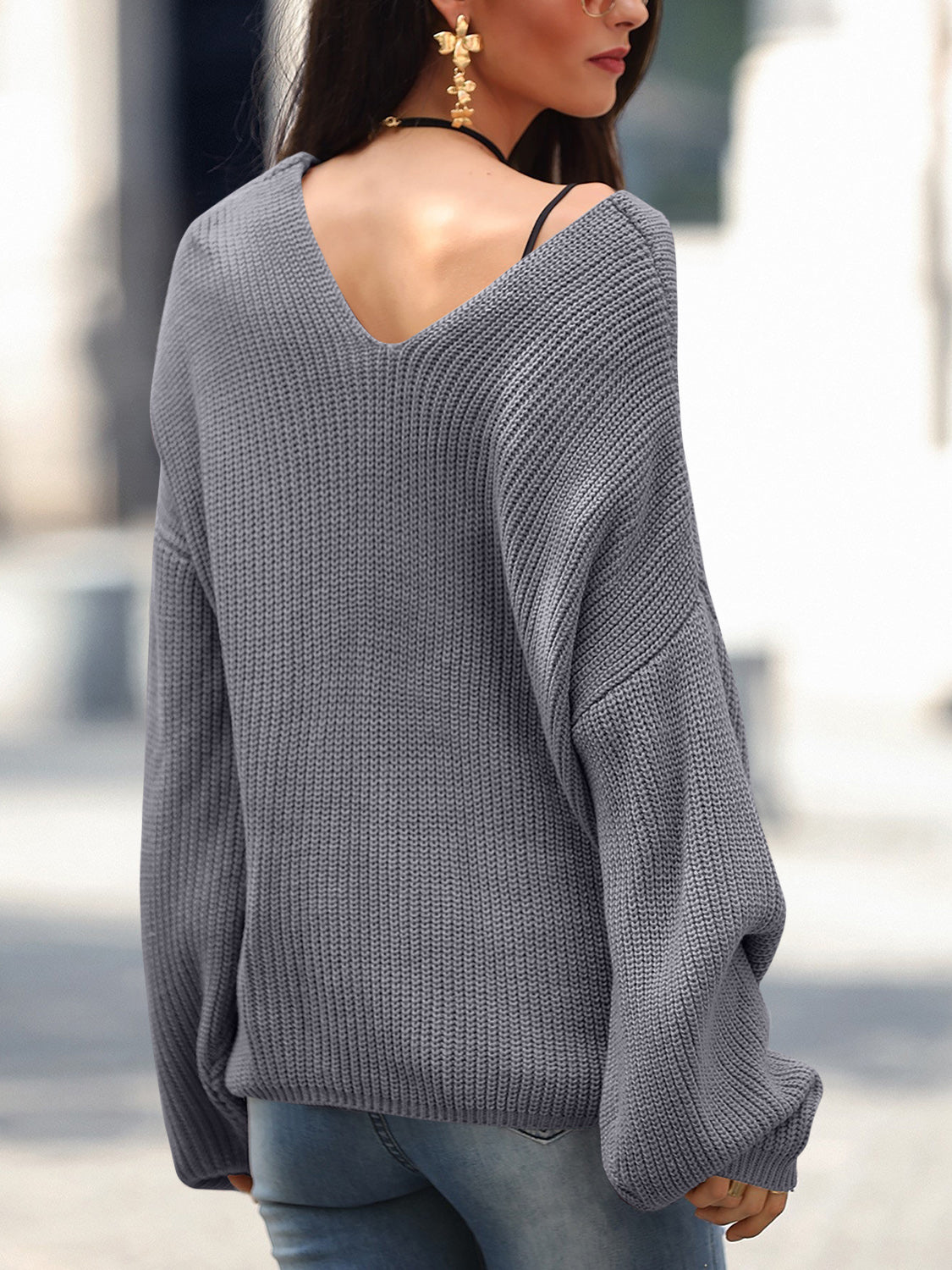 Dark Gray knit sweater with V-neck and slouchy fit, acrylic material.