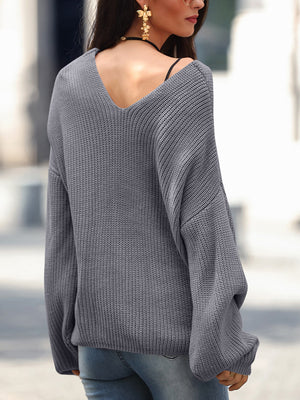 Dark Gray knit sweater with V-neck and slouchy fit, acrylic material.