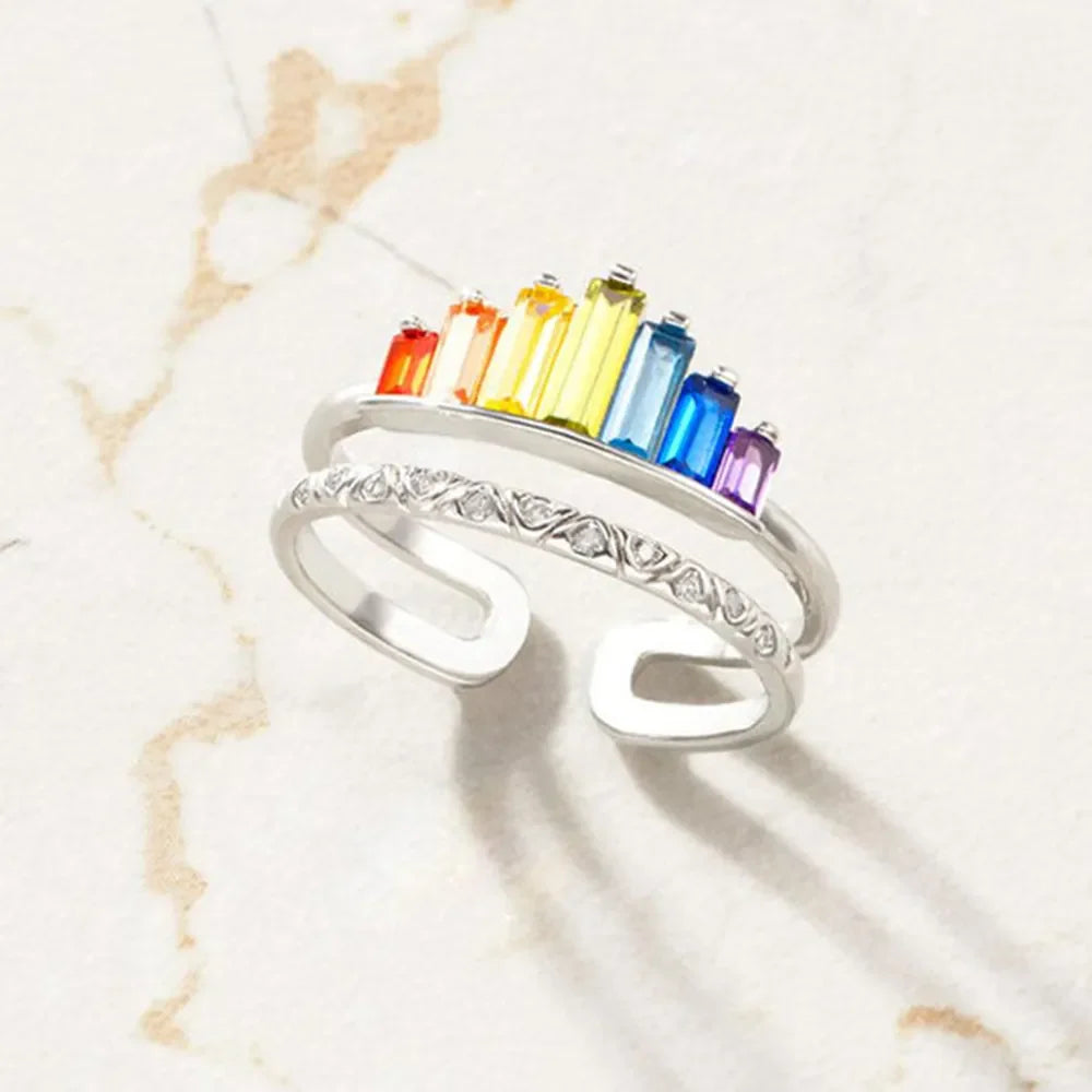 Silver stacked ring set with rainbow baguette crystals and diamond accents