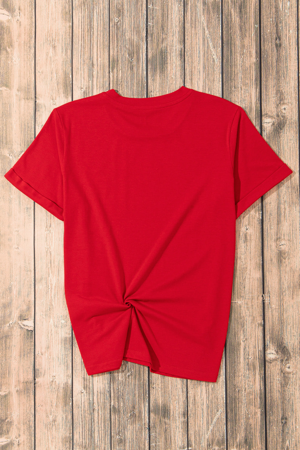 Red t-shirt with twisted hem detail and short sleeves.