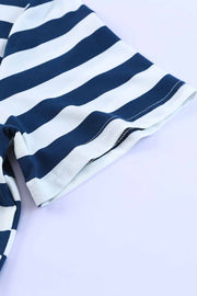 Navy and white striped jersey maxi dress detail showing sleeve and hem.