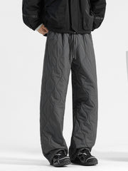 Men's dark gray quilted sweatpants with a relaxed fit and drawstring waist.