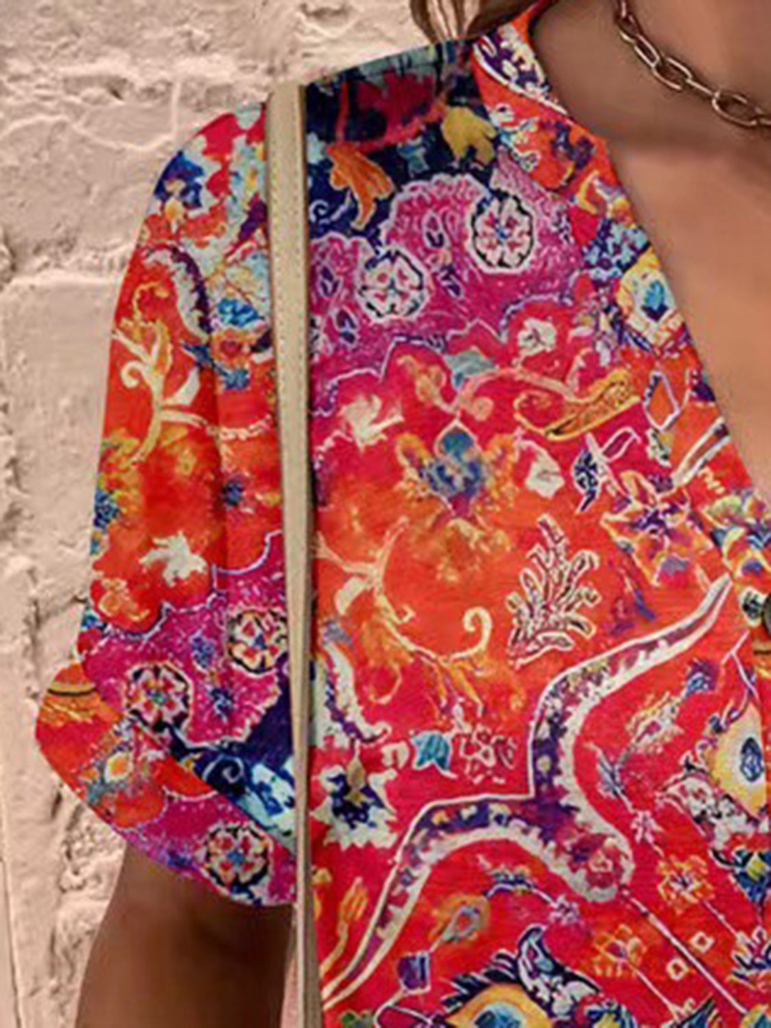 Americana Henley Print Top in vibrant red with a detailed paisley pattern and button detail.