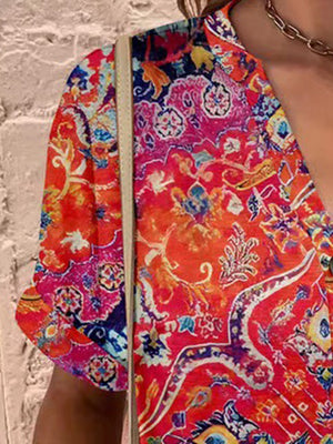 Americana Henley Print Top in vibrant red with a detailed paisley pattern and button detail.