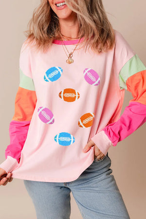 Colorblock long sleeve t-shirt in blush pink with football graphics and contrast sleeves.