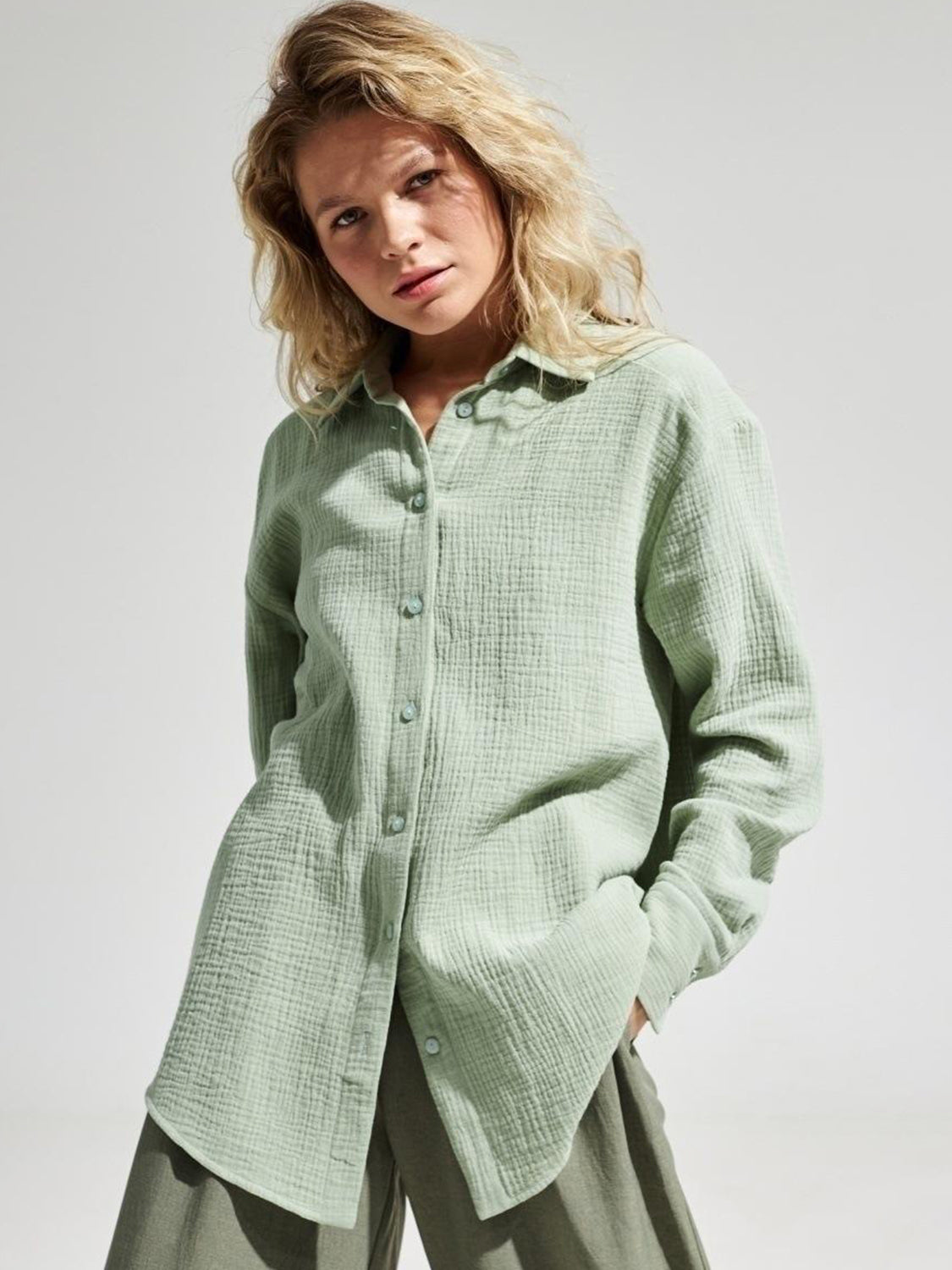 Light green textured cotton overshirt with relaxed fit and button front.