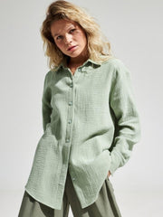 Light green textured cotton overshirt with relaxed fit and button front.