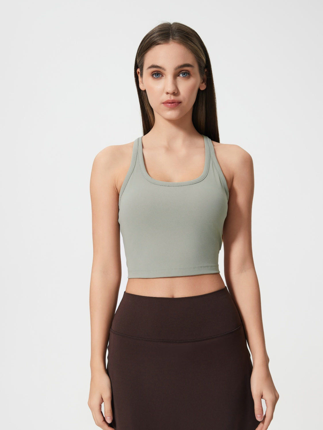 Sculpted racerback crop tank in Sage with a scoop neck.