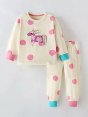 Toddler cream cotton pajama set with pink polka dots and unicorn applique.