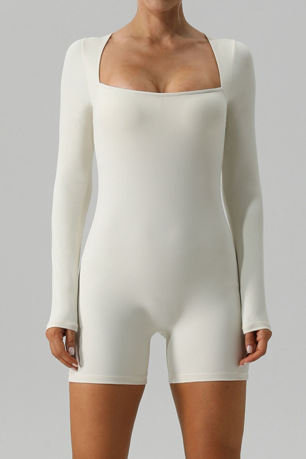 Ivory sculpted square neck long sleeve unitard with short legs