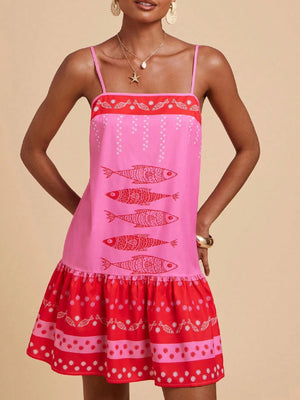 Pink spaghetti strap mini dress with red fish print and tiered ruffle hem