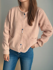 Dusty Pink ribbed knit button-up cardigan with colorful buttons and pockets