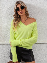 Relaxed fit v-neck knit sweater in yellow-green with long sleeves and ribbed cuffs.