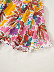 Print bell sleeve mini dress with colorful floral pattern and pom-pom trim hem