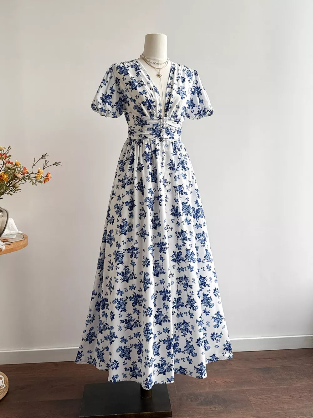 Delightful floral v-neck maxi dress with cinched waist and short sleeves.