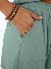 Light green drawstring shorts set with pocket detail