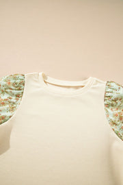Beige ribbed knit top with floral puff sleeves