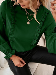 Dark green ruffled yoke blouson sleeve top with gathered cuffs.