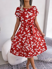 Crimson leaf print midi dress with tie waist and pleated skirt