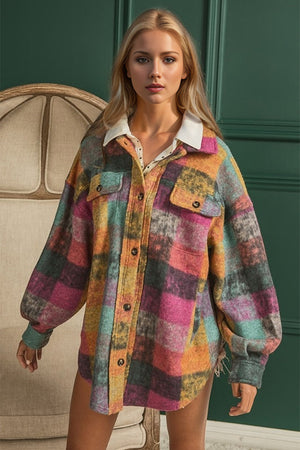 Oversized multicolored plaid shacket with white collar and button front.