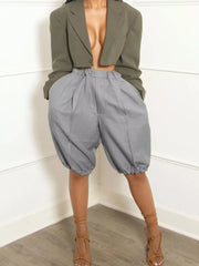 Gray pleated high-waisted shorts with drawstring and balloon leg