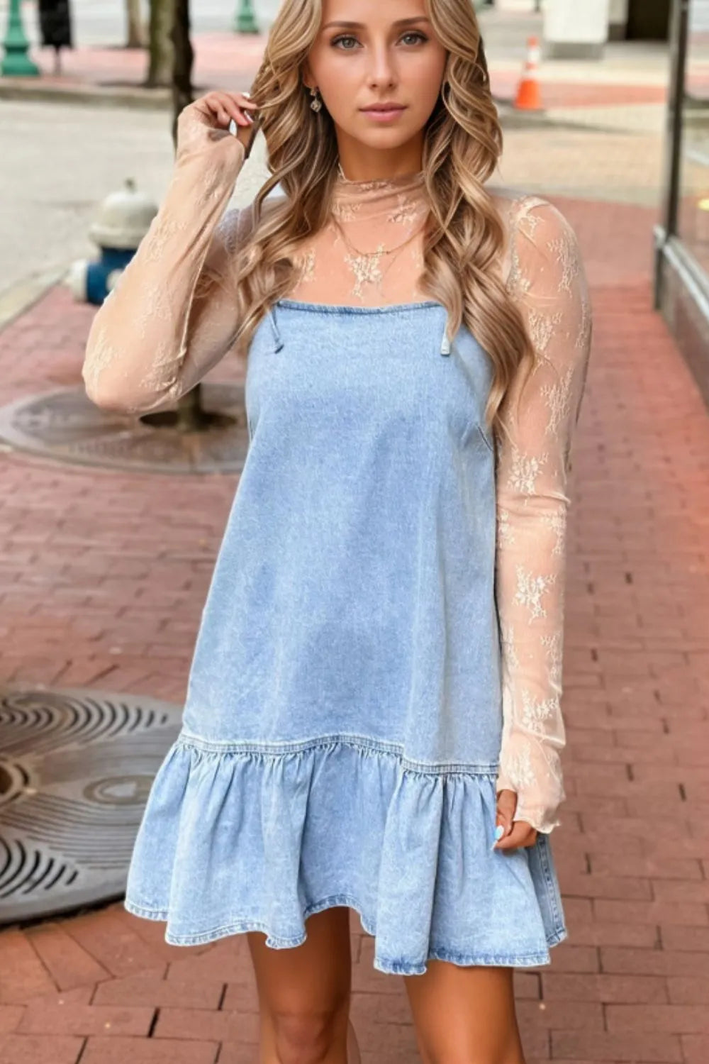 Light blue denim sundress with ruffled hem and spaghetti straps.