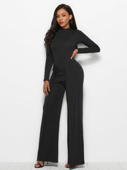 Black high-waisted palazzo jumpsuit with long sleeves and a slit front.