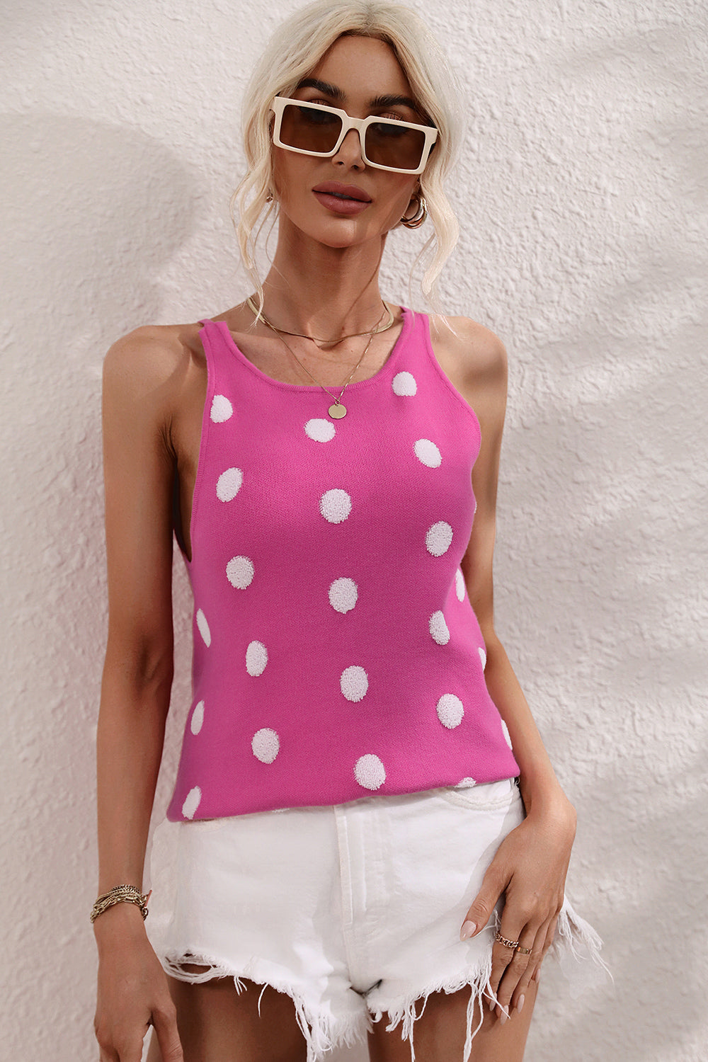 Hot Pink polka dot knit tank top with a keyhole neckline and round neck.