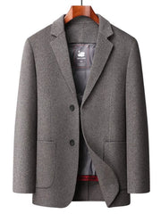 Men's gray wool button-up overcoat with two buttons and flap pockets.
