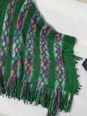 Dark green knit cape with diamond pattern and fringe detail