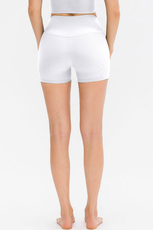 White ribbed sculpting active shorts with a high waist and v-seam detail.