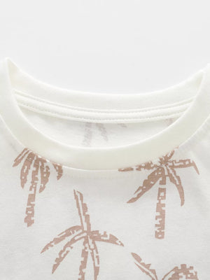 Toddler white cotton blend t-shirt with tropical palm print and crew neck.