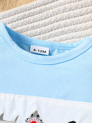 Baby t-shirt and shorts set in pastel blue and white with embroidered sharks.