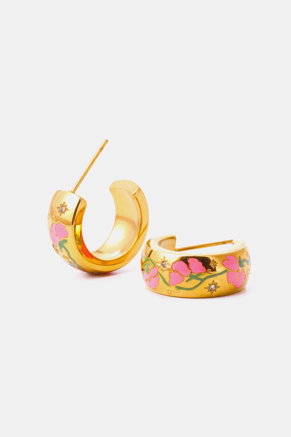 Gold hoop earrings with pink floral enamel and small crystal accents.