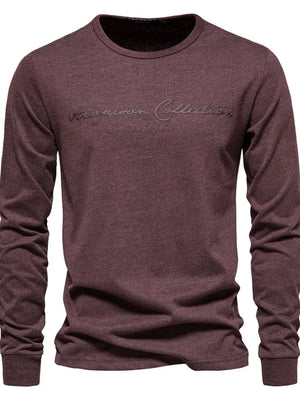 Burgundy crewneck long sleeve tee with embroidered script logo detail