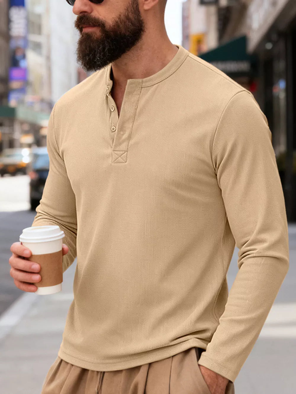 Men's Khaki long sleeve cotton Henley t-shirt with button placket and textured detail.