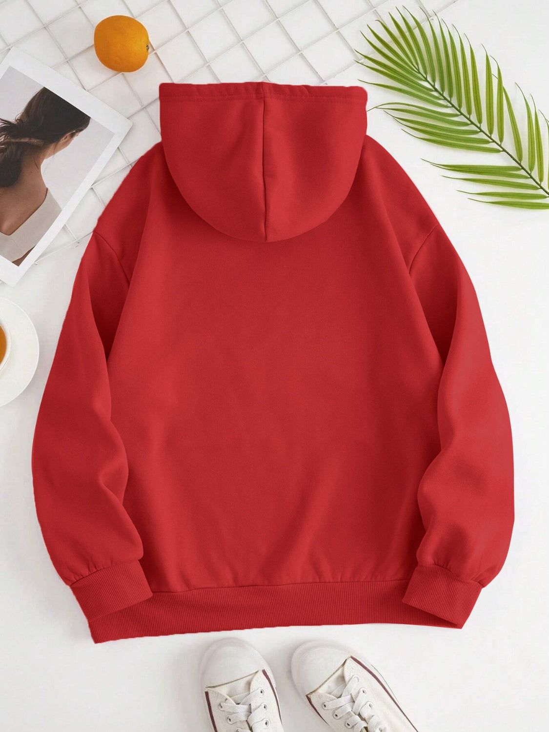 Red oversized hoodie with pouch pocket and ribbed cuffs and hem.
