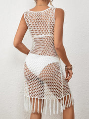 White open-knit beach cover-up dress with fringe hem and sleeveless design.